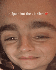 a close up of a face with the words in spain but the s is silent