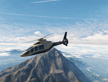 a helicopter is flying over a mountain with the letters sdc on the side