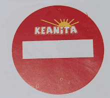 a red sign that says keanita with a sun on it