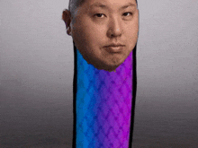 a man 's head is visible in a blue and purple cylinder