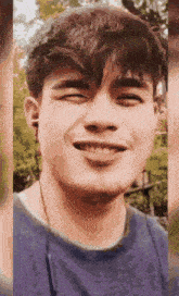 a close up of a man 's face with his eyes closed smiling