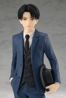 a figurine of a man in a suit and tie is holding a top hat