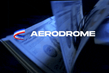 a stack of money with the aerodrome logo in the background