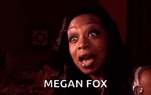 a woman is making a funny face and the name megan fox is on the bottom