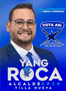 a man in a suit and tie stands in front of a blue background that says yang roca