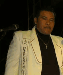 a man in a white jacket with la difference written on it