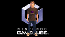 a man is standing in front of a nintendo gamecube