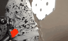 a person in a mickey mouse shirt is holding a microphone