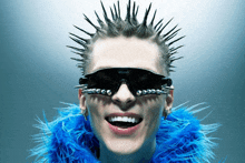 a woman wearing a mohawk and sunglasses with the word sunglasses on them