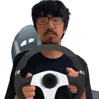 a man with glasses is holding a steering wheel in his hands
