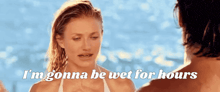 a woman in a bikini says i 'm gonna be wet for hours next to a man in a bathing suit