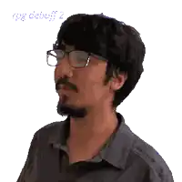 a pixelated image of a man with glasses and a mustache that says attack down