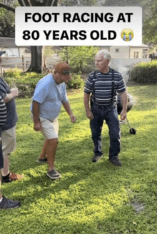 a group of men are standing on a lush green lawn with the caption foot racing at 80 years old