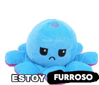 a blue stuffed octopus with a black sticker that says " estoy furroso "