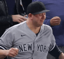 a man is wearing a new york jersey and hat