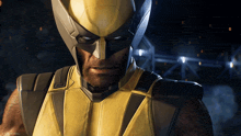 a close up of wolverine 's face with the word marvel on the bottom