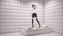 a woman standing on a bed in a room