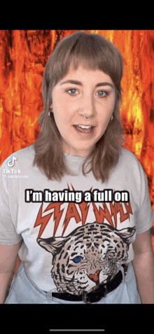 a woman wearing a t-shirt that says " i 'm having a full on " on it