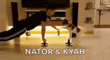 a man is doing push ups with a dog standing next to him .