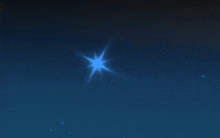 a blue star shines brightly in the dark blue sky