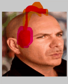 a close up of a man 's face with a red and orange headphone on his head