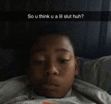 a young boy is laying in bed with a snapchat caption that says so u think u a lil slut huh