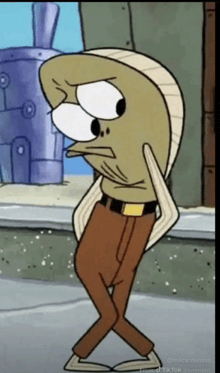 a cartoon character from spongebob squarepants is standing on a sidewalk