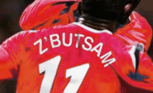 a soccer player wearing a red jersey with the number 17 on the back