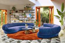 a living room with a blue sectional couch and a coffee table