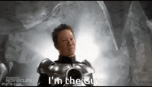a man in armor is saying `` i 'm the guy '' in a cave .
