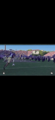 a football player in a purple jersey with the number 26 on it