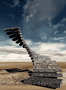 a staircase in the desert with a blue sky behind it