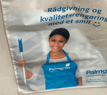 a palmgren advertisement with a smiling woman in an apron holding a mop