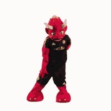 a red mascot wearing a black adidas shirt and black shorts