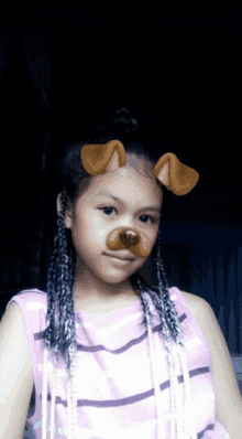 a girl with braids and a dog ear filter on her face