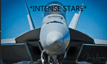 a close up of a fighter jet with the words intense stare