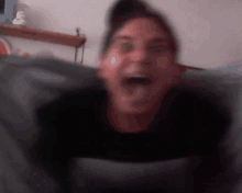 a blurry picture of a person 's face with their mouth open