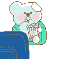 a teddy bear is sitting on a couch eating pop corn