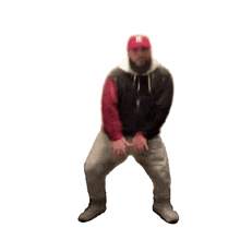 a man wearing a ny hat is dancing on a white background .