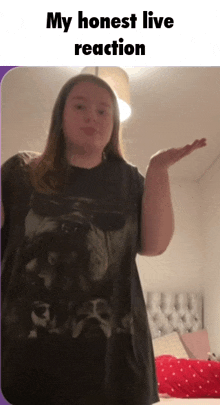 a girl wearing a black shirt with a picture of a dog says my honest live reaction