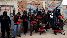 a group of men with guns are standing in front of a brick wall with destiny g written on it