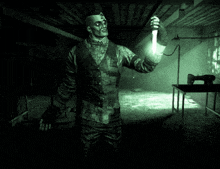 a man in a suit and vest is holding a knife in a dark room