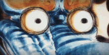 a close up of a cartoon character 's face with big eyes