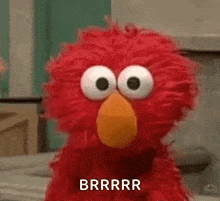 elmo from sesame street is making a funny face and saying brrrr .
