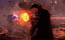 doctor strange is kneeling down in front of a fireball in a video game while holding a sword .