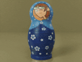 three russian nesting dolls with flowers on them
