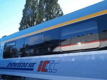 a blue and white train with the words dowiedz sie icc on the side