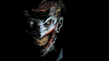 a close up of the joker 's face with a sharp needle sticking out of it