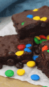 a close up of a brownie with m & ms on it