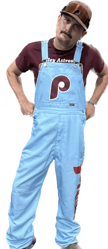 a man wearing overalls with the letter p on it